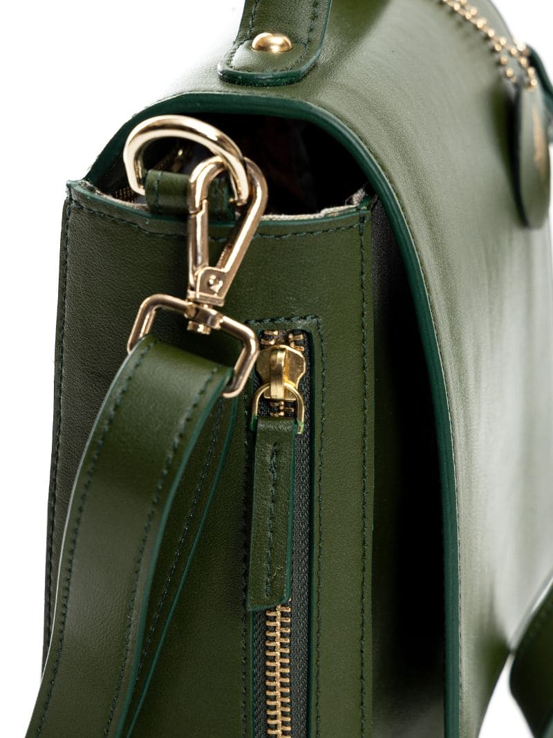 Close-up of Ceres green plant leather crossbody bag showing strap attachment, metal hardware and zipper detail