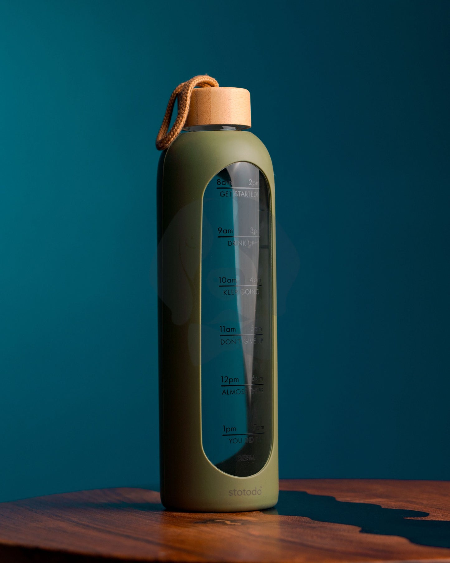 Stotodo Pillar Portable Glass Bottle Green with Bamboo Lid in an Office