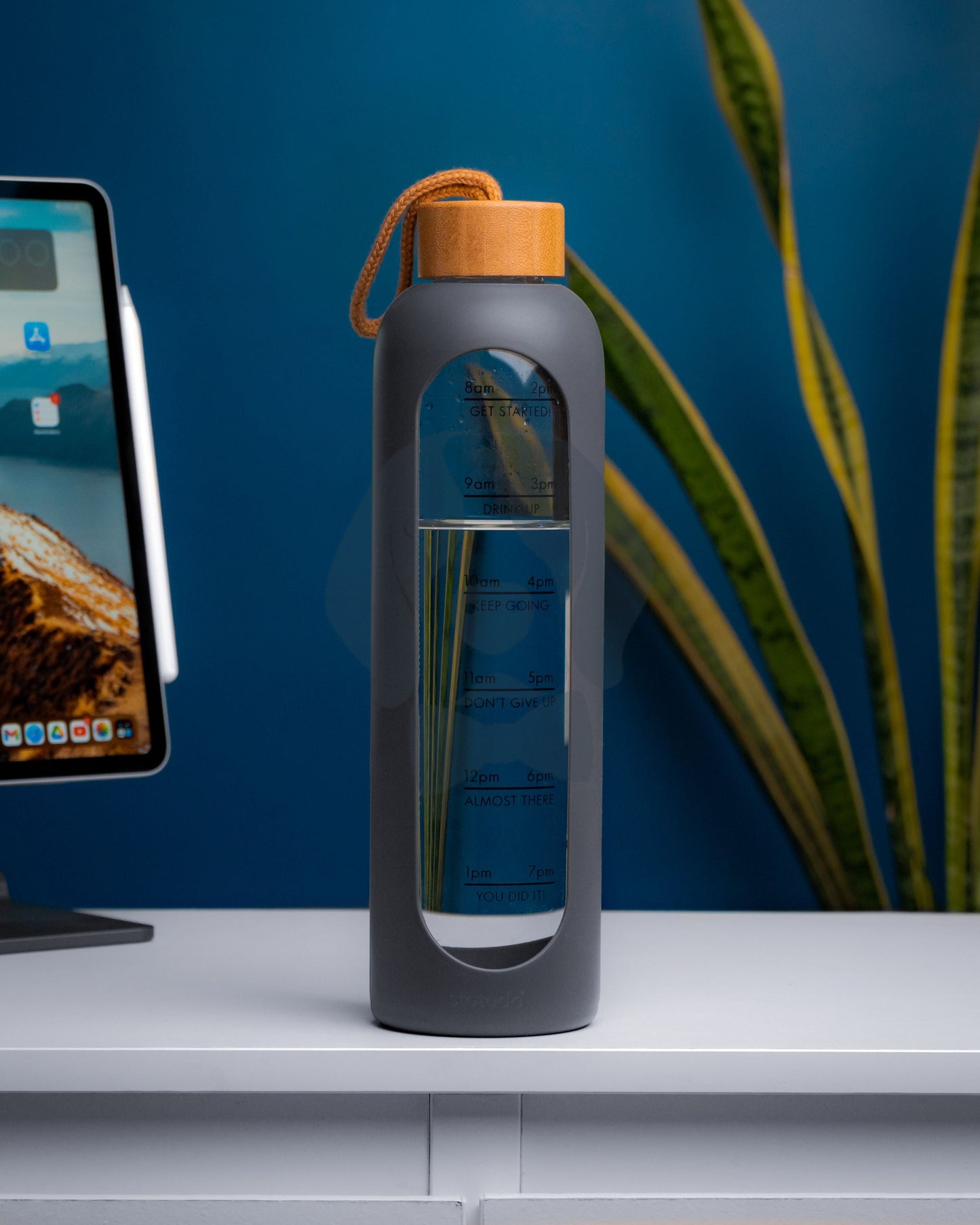 Stotodo Pillar Portable Glass Bottle Grey with Bamboo Lid on an Office Desk