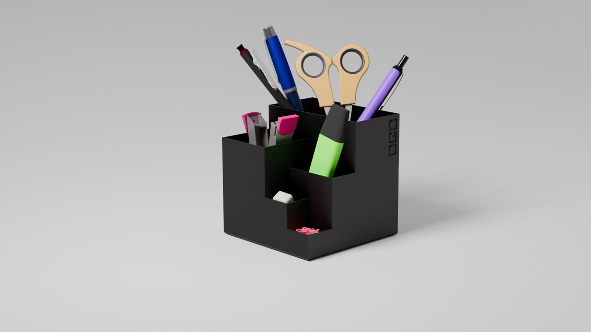 Organized black pen holder with designated slots for pens, markers, and accessories