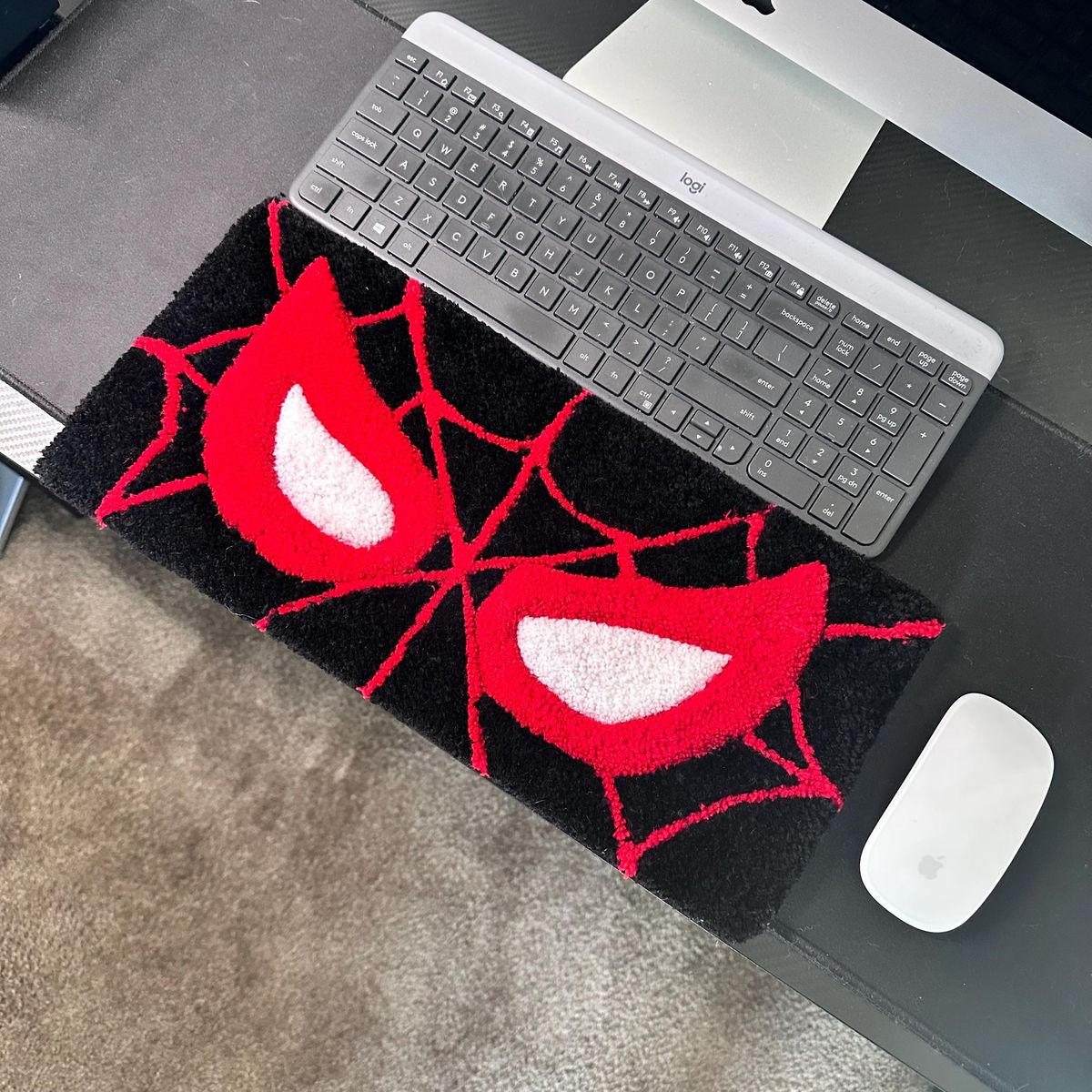 Spider-Man hand-tufted keyboard rug on gaming desk setup